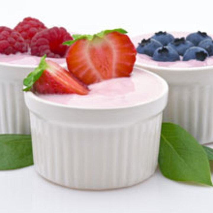 3 cups of yogurt with raspberries, strawberries, and blueberries